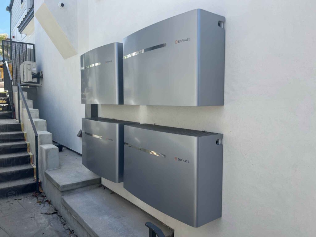 A neatly installed solar battery storage system mounted on a wall.