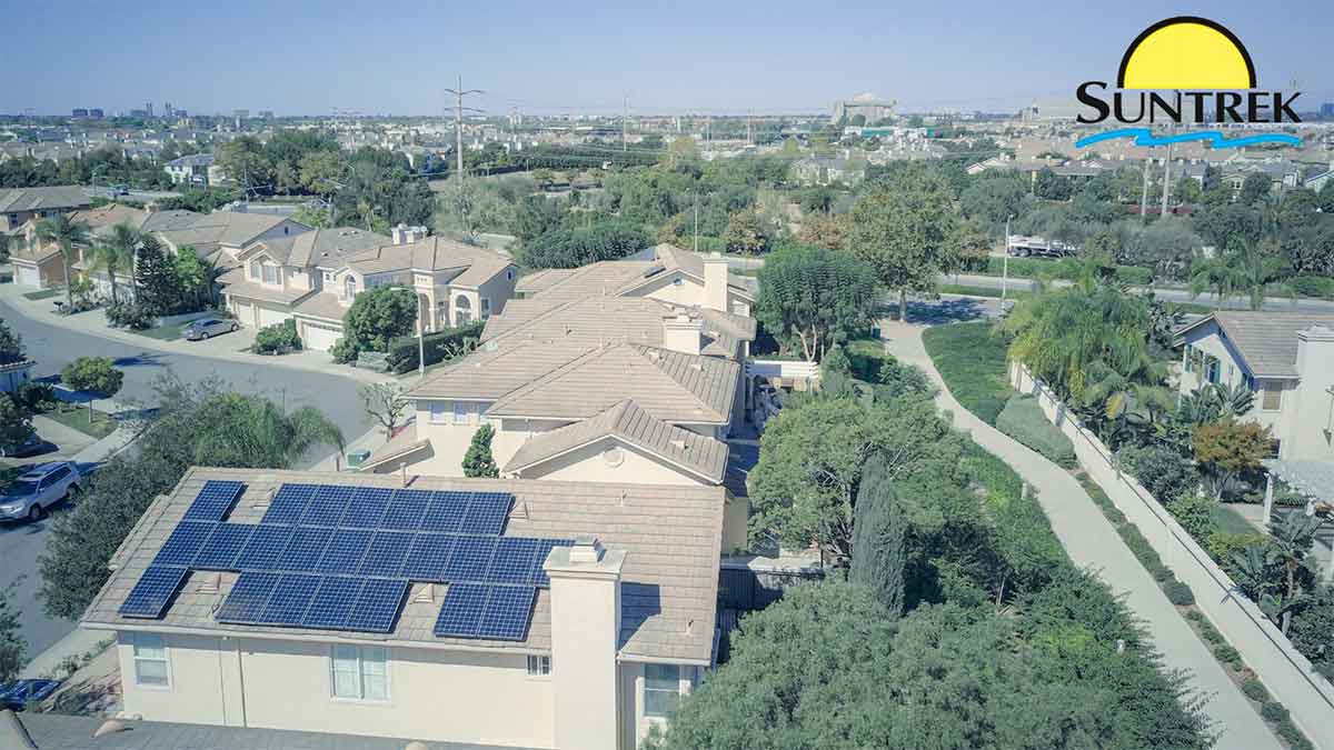 Neighborhood view with a home equipped with solar panels.