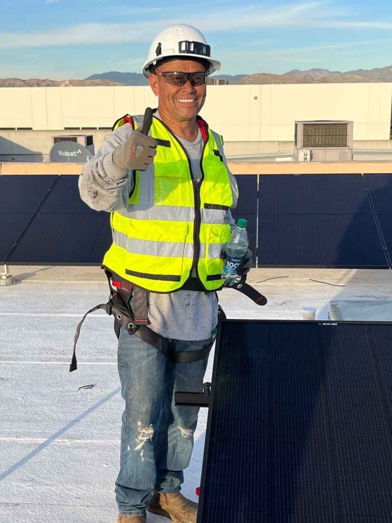 Solar expert from Suntrek standing in uniform.