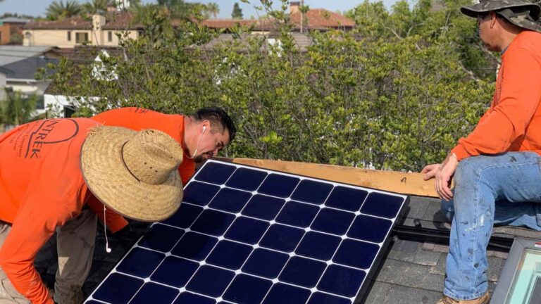 Expert technicians from Suntrek setting up solar panels on a home.