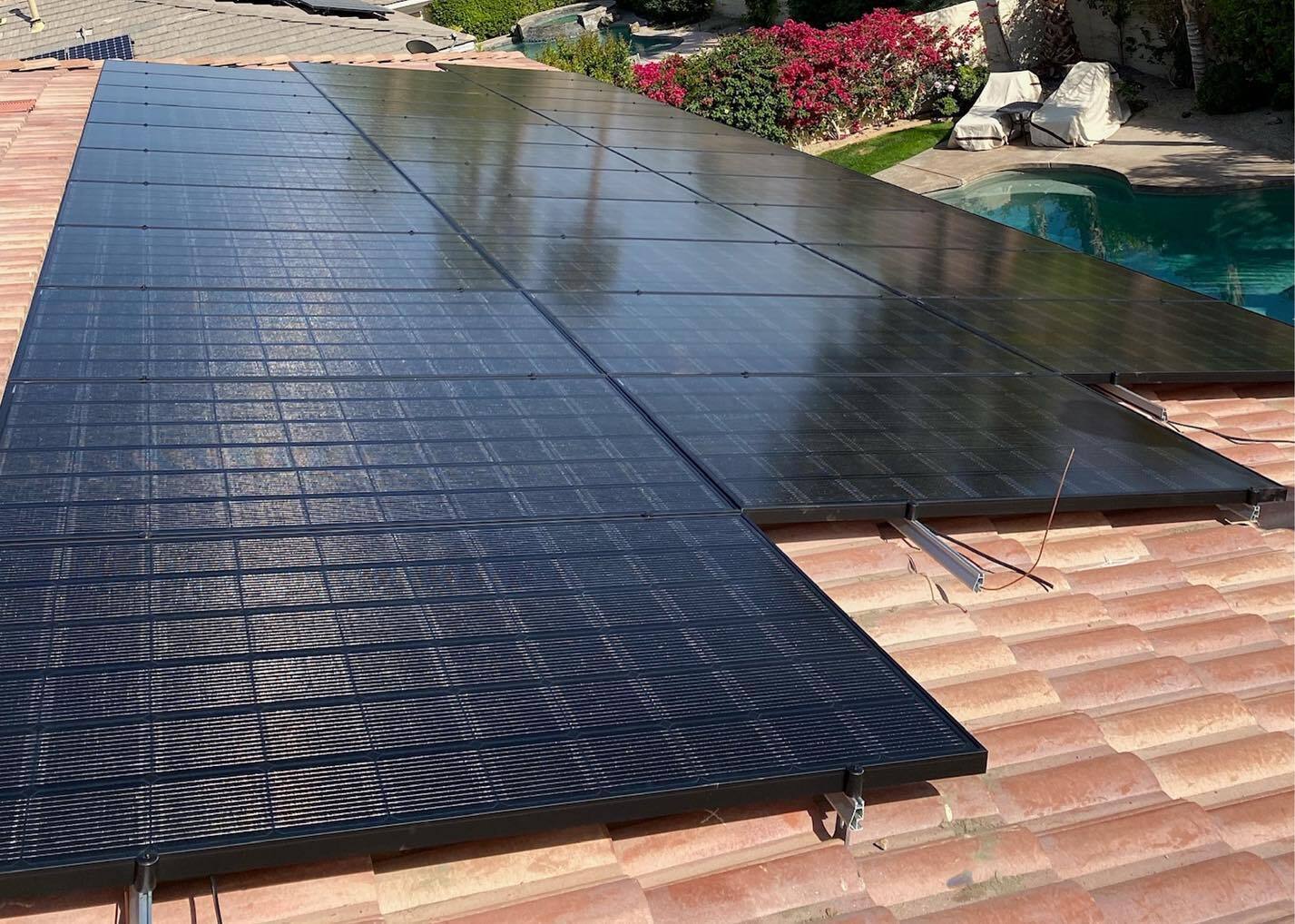 Solar panels installed on the roof of a modern suburban home