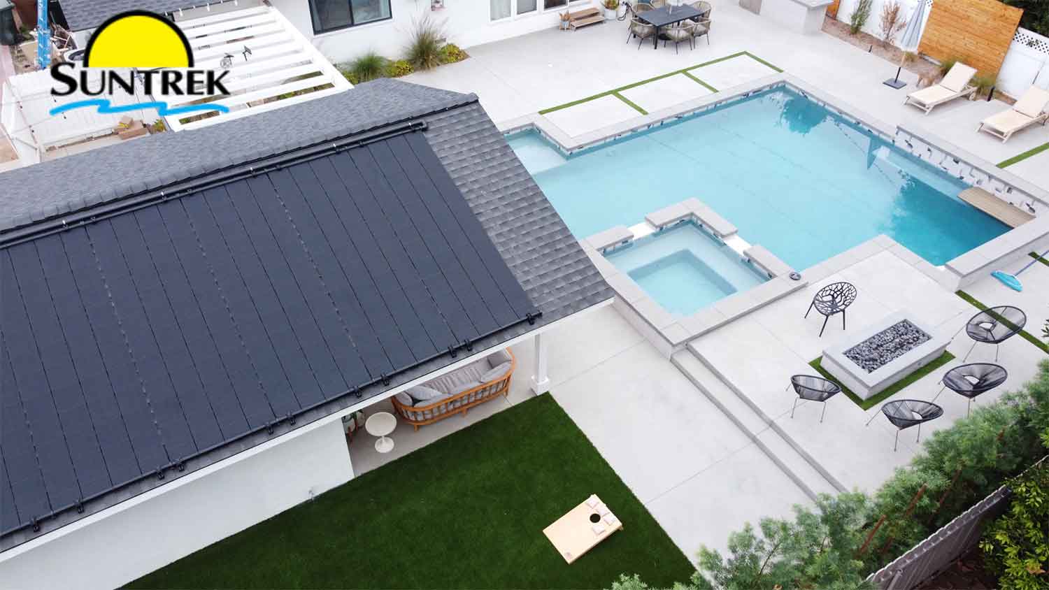 Residential backyard with swimming pool and solar panels installed on the roof