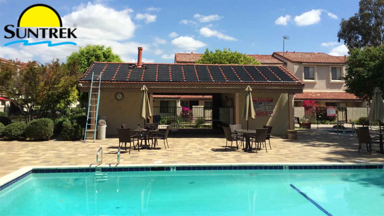 A residential backyard with a swimming pool operating on solar energy