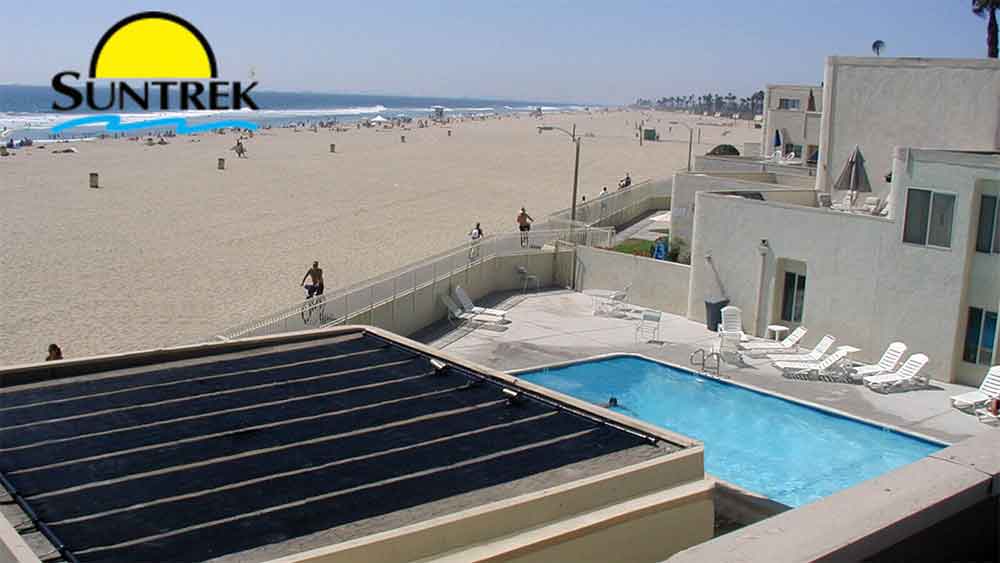 A residential home featuring a swimming pool powered by solar energy