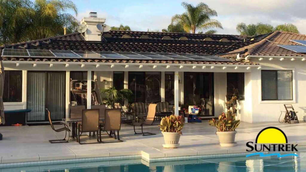 Modern home featuring a backyard swimming pool and solar panels installed on the roof.