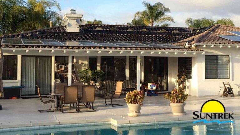 Modern home featuring a backyard swimming pool and solar panels installed on the roof.