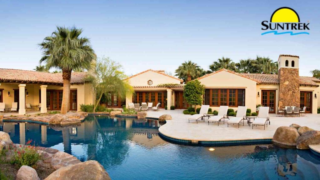 Southern California house featuring a swimming pool and landscaped surroundings.