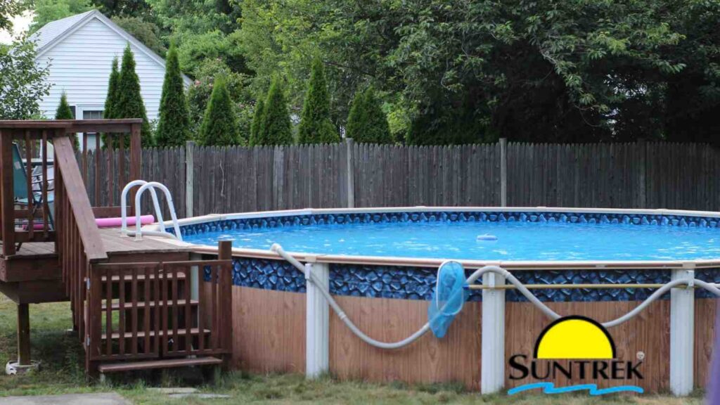 Backyard view of a house featuring an above-ground pool