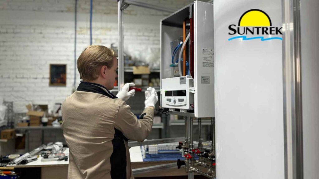 Technician working on a solar battery system installed inside a arage.