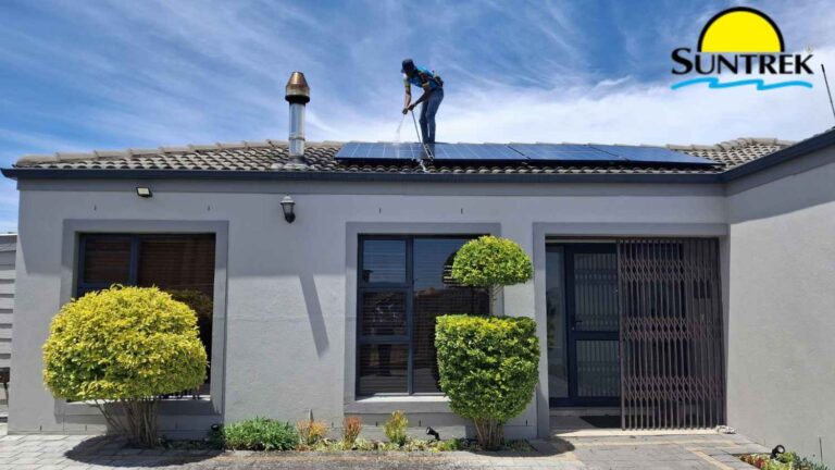 Technician relocating solar panels on the roof of a residential home.