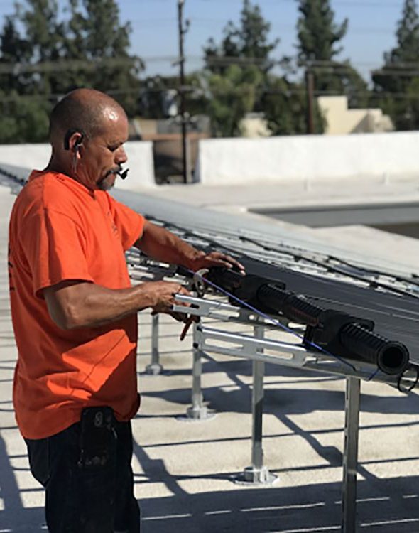 A team of professionals working on mounting solar panels.