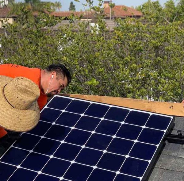 Suntrek technicians working on roof to install solar panels