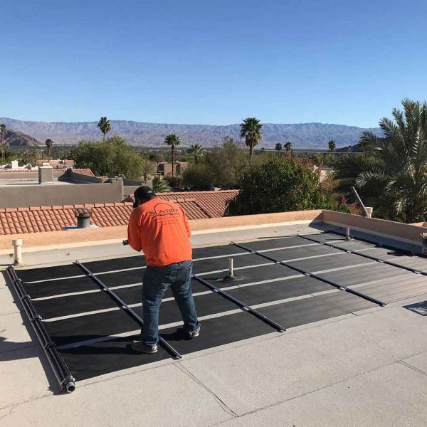 A Suntrek expert installing and maintaining solar panels on a roof