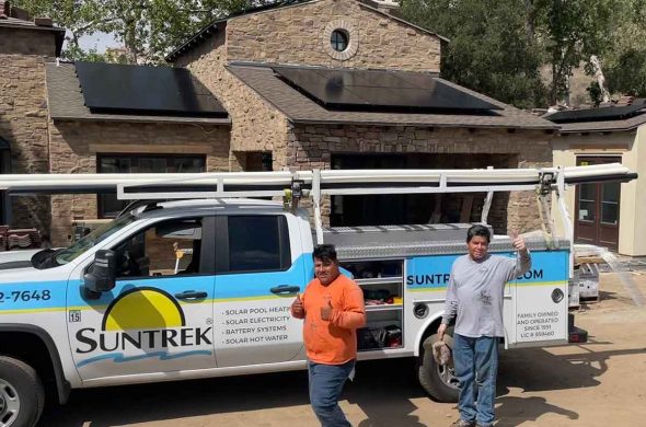 Suntrek team members standing outside a customer's home