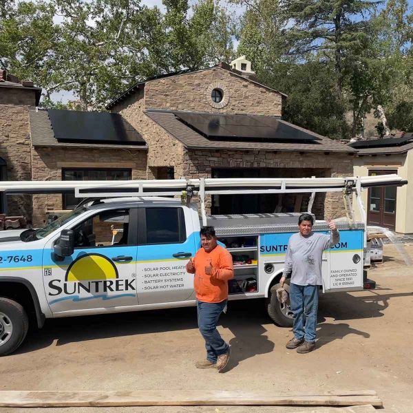 Suntrek team members standing outside a customer's home