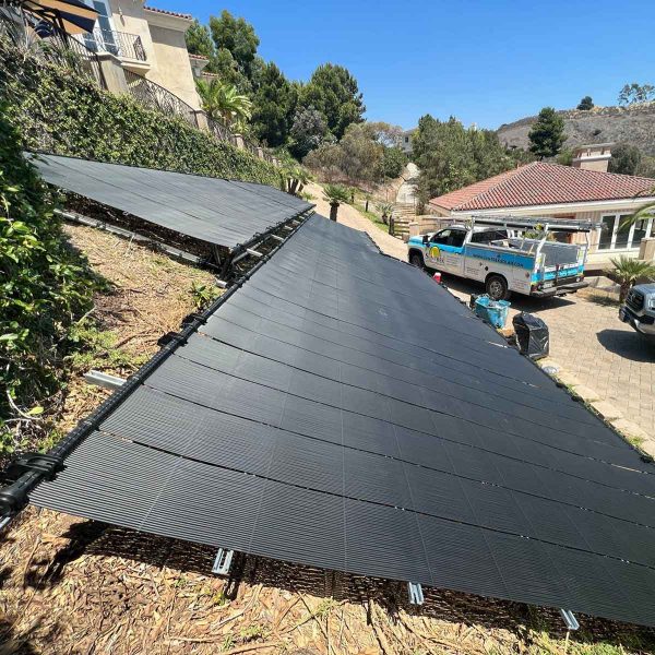 A rooftop covered with solar panels capturing sunlight for energy
