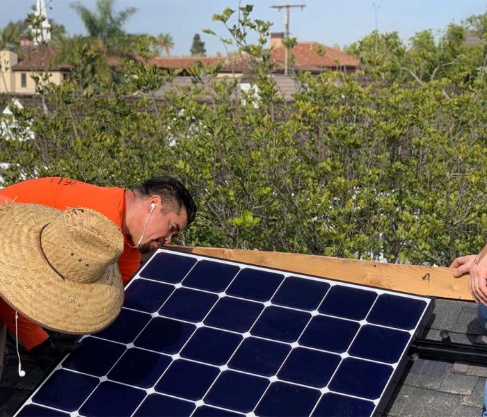 Professionals from Suntrek working on rooftop solar panel installation