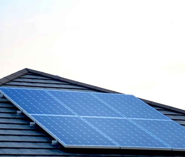 Roof of a home equipped with multiple solar panels